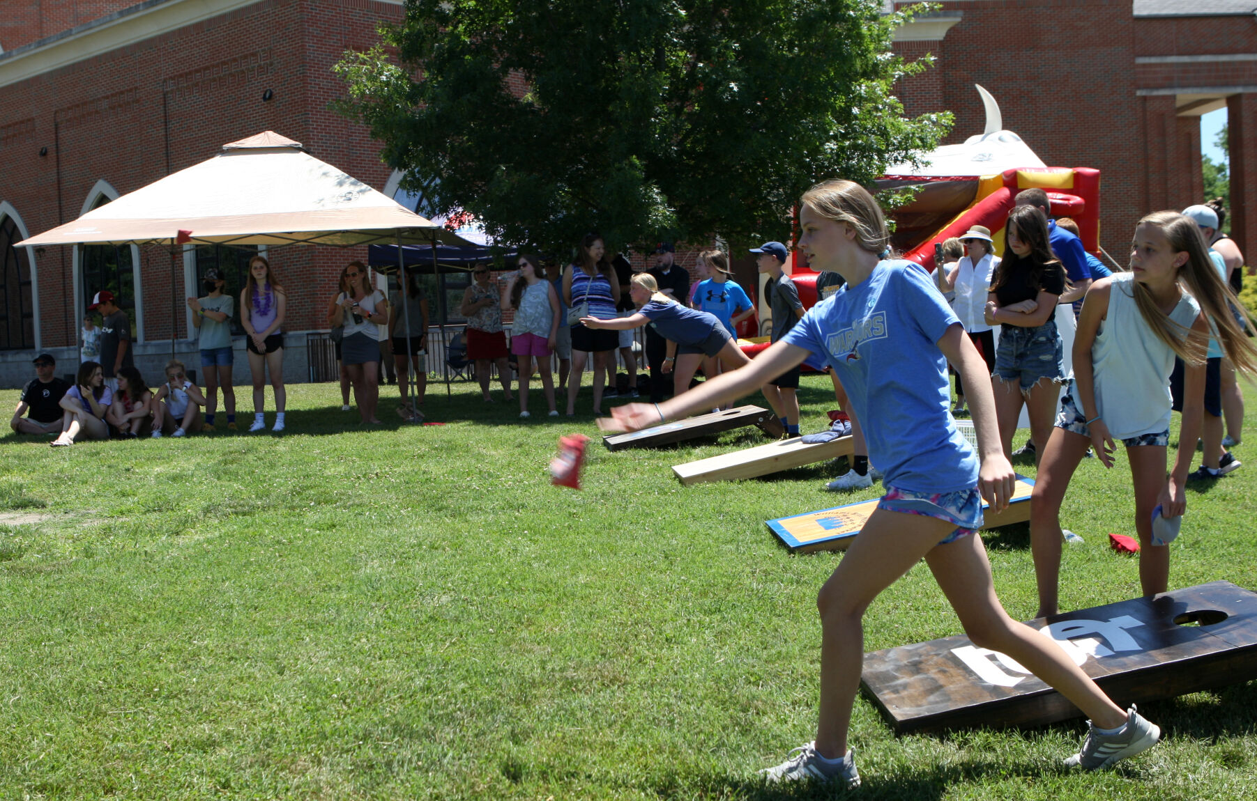 Lily Jones throws a bean bag